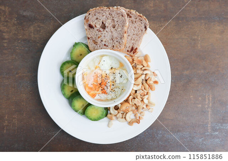 whole wheat bread or sourdough bread with nuts and soft boiled egg whole wheat bread or sourdough bread with nuts and soft boiled egg 115851886
