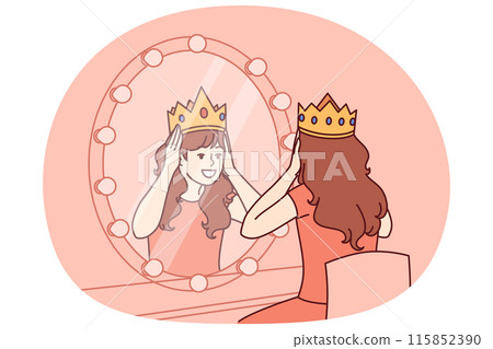 Little actress tries on crown sitting near mirror and dreams of playing role of princess on theater 115852390