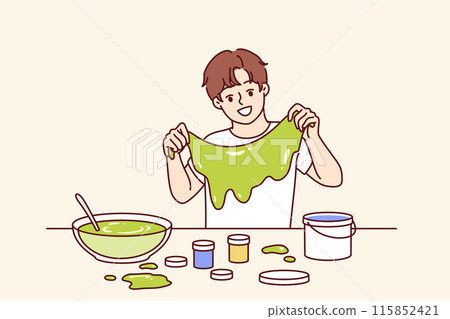 Homemade slime in hands boy who made toy thanks to knowledge of chemistry from elementary school 115852421