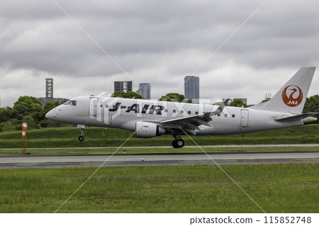 Passenger plane, airplane, J-AIR Embraer 190 landing at Osaka Airport and Itami Airport in the rain Passenger plane, airplane, J-AIR Embraer 190 landing at Osaka Airport and Itami Airport in the rain 115852748