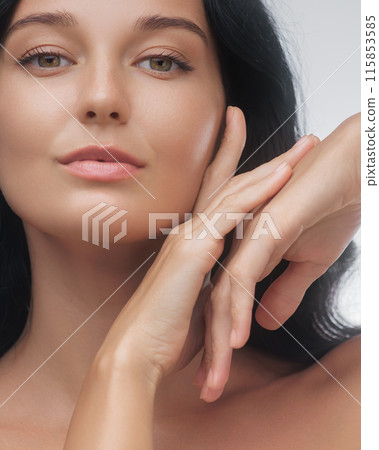 Elegant Asian Woman with Flawless Skin Posing Gracefully 115853585