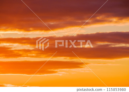 cloudy weather meteorology background. cumulus clouds on the blue sky blown by the wind. orange glow 115853980