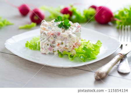 vegetable salad with boiled vegetables and dressed with mayonnaise 115854134