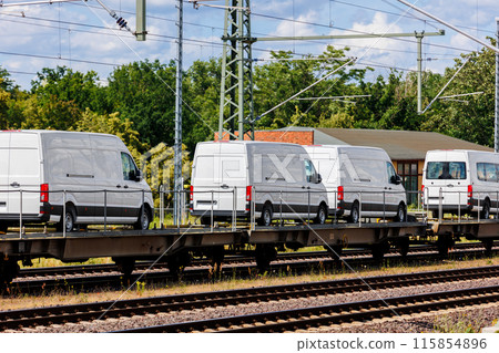 Many new modern electric and fuel cars vans transportation by cargo freight train railway wagon. Railroad export and import automotive logistics service. Safety and insurance goods shipping industry 115854896