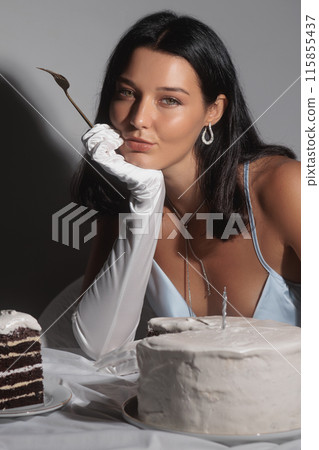Elegant Luxury Woman in Satin Dress with Cake and Candle 115855437
