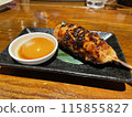 Meatball skewers and raw egg 115855827