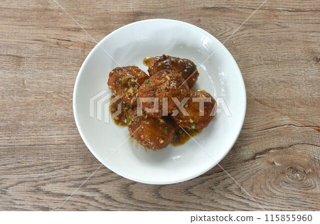 fried salt crispy chop chicken meat dreading garlic and pepper gravy sauce on plate  115855960