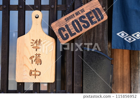 In front of the store preparing to open 115856952