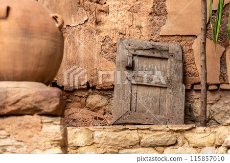 Beautiful old window shutter leaning at a facadeof a house in Agadir 115857010