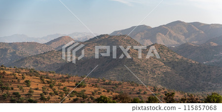 Sunset over a beautiful peaceful landscape of the Anti-Atlas mountains near Tirourgane Sunset over a beautiful peaceful landscape of the Anti-Atlas mountains near Tirourgane 115857068