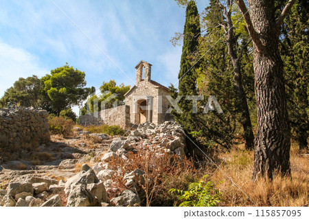 Scenic little chapel in the remoteness of the hills of Hvar island Scenic little chapel in the remoteness of the hills of Hvar island 115857095