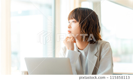 Young business woman thinking 115858113