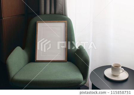 Retro modern compositon of Scandinavian living room interior with design green armchair. Blank wooden picture frame, poster mock up template. Coffee table with cup near window. Elegant hotel room. Retro modern compositon of Scandinavian living room interior with design green armchair. Blank wooden picture frame, poster mock up template. Coffee table with cup near window. Elegant hotel room. 115858731