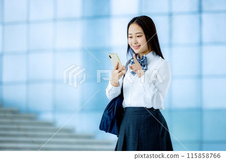 High school girl operating a smartphone 115858766