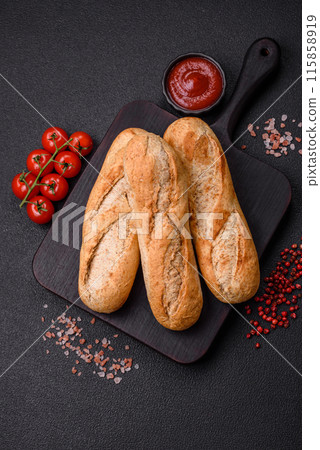 Crispy mini baguette with seeds and grains, salt and spices Crispy mini baguette with seeds and grains, salt and spices 115858919