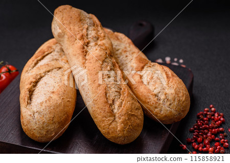 Crispy mini baguette with seeds and grains, salt and spices Crispy mini baguette with seeds and grains, salt and spices 115858921