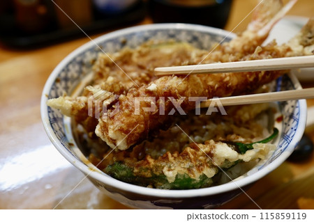 Tempura bowl topped with a generous amount of shrimp 115859119