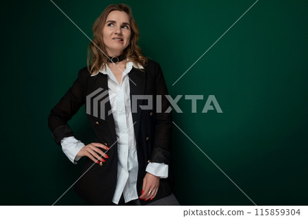 Woman Standing in Front of Green Wall 115859304