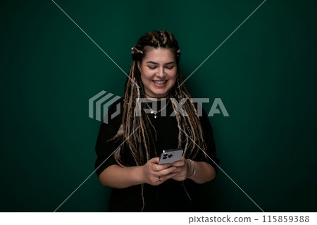 Woman With Dreadlocks Holding Cell Phone Woman With Dreadlocks Holding Cell Phone 115859388
