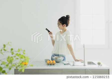 Woman in the kitchen Woman in the kitchen 115860233