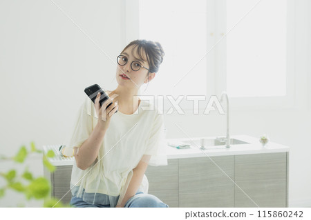 Woman in the kitchen 115860242