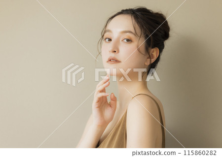 Young woman beauty image beige background 115860282