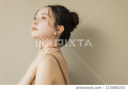 Young woman beauty image beige background 115860283