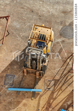 Forklift in an industrial yard 115860684