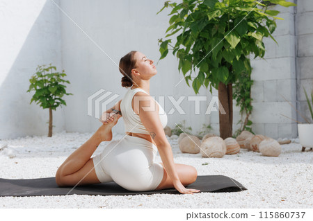yoga stretching outdoors. side view of overweight woman practicing yoga on white background, body care concept 115860737