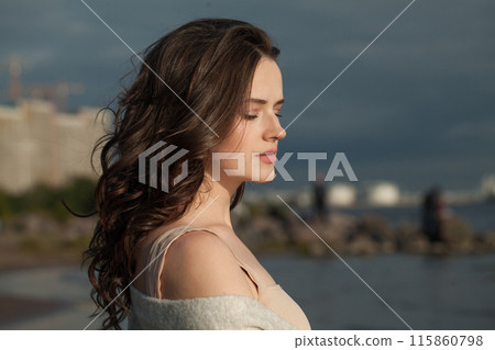 Glamorous young lady brunette model on sea beach. Beauty woman with makeup  115860798