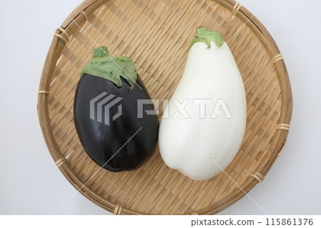 White eggplant and American eggplant on a bamboo basket 115861376