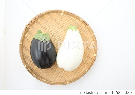White eggplant and American eggplant on a bamboo basket White eggplant and American eggplant on a bamboo basket 115861380