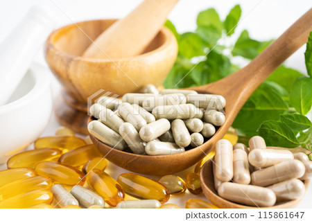 Alternative medicine herbal organic capsule with vitamin E omega 3 fish oil, mineral, drug with herbs leaf natural supplements for healthy good life. Alternative medicine herbal organic capsule with vitamin E omega 3 fish oil, mineral, drug with herbs leaf natural supplements for healthy good life. 115861647