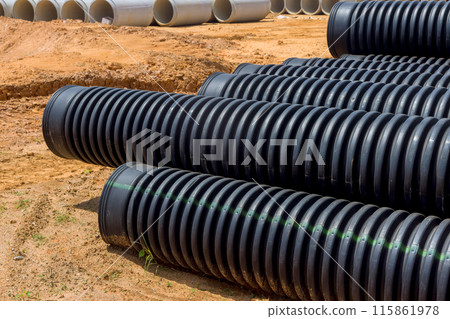 Flowing rainwater into main collecting container using plastic black pipes Flowing rainwater into main collecting container using plastic black pipes 115861978