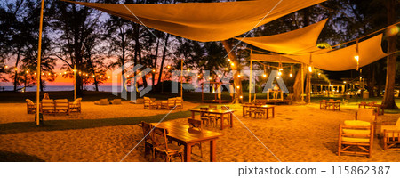 Sunset at the beach bar in Mai Khao Beach Resort in Phuket Thailand Sunset at the beach bar in Mai Khao Beach Resort in Phuket Thailand 115862387