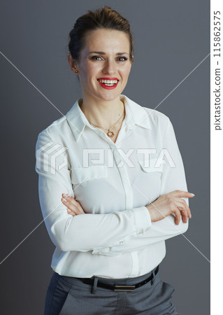 happy trendy woman worker isolated on gray 115862575
