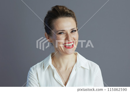 smiling elegant 40 years old woman worker isolated on gray smiling elegant 40 years old woman worker isolated on gray 115862590