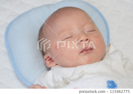 Image of a baby sleeping soundly on a pillow Image of a baby sleeping soundly on a pillow 115862775