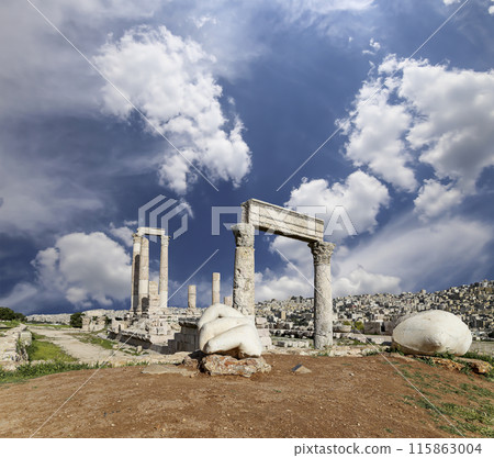Amman city landmarks-- old roman Citadel Hill, Jordan. Against the background of a beautiful sky with clouds Amman city landmarks-- old roman Citadel Hill, Jordan. Against the background of a beautiful sky with clouds 115863004