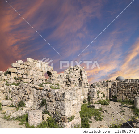 Amman city landmarks-- old roman Citadel Hill, Jordan. Against the background of a beautiful sky with clouds 115863078