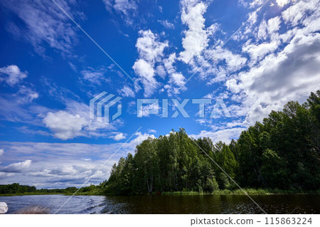 Beautiful summer river at sunny day with clouds reflection in the water 115863224