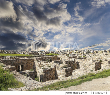 Amman city landmarks-- old roman Citadel Hill, Jordan. Against the background of a beautiful sky with clouds 115863251
