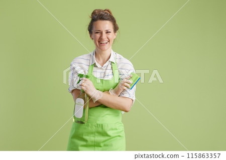 smiling modern female isolated on green background 115863357