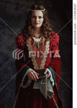medieval queen in red dress with book and handkerchief medieval queen in red dress with book and handkerchief 115863687