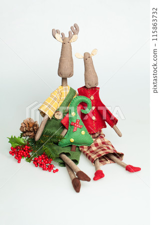 Colorful linen toy or decoration for Christmas on white background Colorful linen toy or decoration for Christmas on white background 115863732