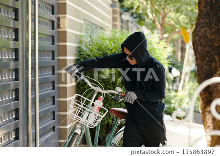 Thief Stealing The Bike Outdoors 115863897
