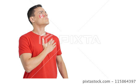 Man listening to the Canada national anthem with solemnity Man listening to the Canada national anthem with solemnity 115864397