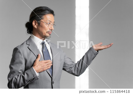 Portrait of a senior businessman with his hand on his chest 115864418