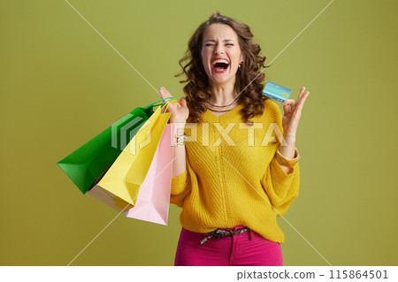 happy healthy woman isolated on green background 115864501