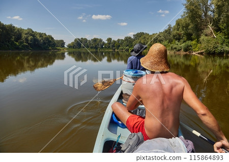 Canoe tour on a river Canoe tour on a river 115864893